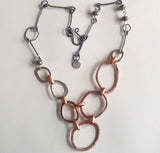 Hoops, sterling silver, pyrite, and copper necklace